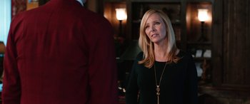 Movie still from “Table 19” (2017), directed by Jeffrey Blitz – A woman standing in front of a man in a room; Close Up shot, Over the shoulder angle