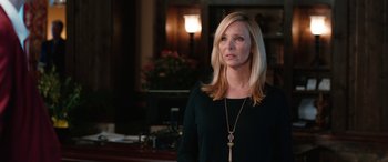 Movie still from “Table 19” (2017), directed by Jeffrey Blitz – A woman with blonde hair wearing a black top; Close Up shot, Over the shoulder angle