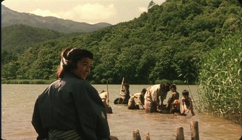 Movie still from “Taboo” (1999), directed by Nagisa Ôshima – A group of people in a body of water; Wide shot, High angle