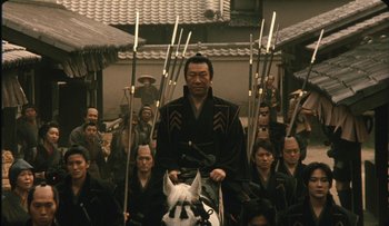 Movie still from “Taboo” (1999), directed by Nagisa Ôshima – A group of men in traditional garb with swords; Medium shot, High angle