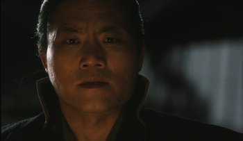 Movie still from “Taboo” (1999), directed by Nagisa Ôshima – A man's face in the dark; Close Up shot, Low angle