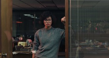 Movie still from “Taipei Story” (1985), directed by Edward Yang – A woman leaning against a wall in front of a window; Medium shot, Low angle