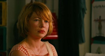Movie still from “Take This Waltz” (2011), directed by Sarah Polley – A person with short blonde hair; Close Up shot, Over the shoulder angle