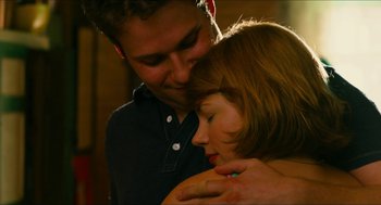 Movie still from “Take This Waltz” (2011), directed by Sarah Polley – A man and a woman embracing each other; Close Up shot, High angle