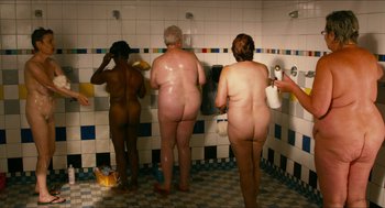 Movie still from “Take This Waltz” (2011), directed by Sarah Polley – A group of naked people in a bathroom shower; Wide shot, Overhead angle
