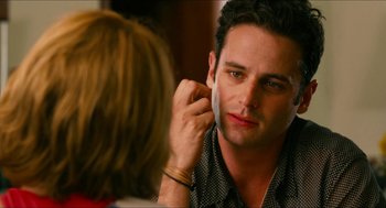 Movie still from “Take This Waltz” (2011), directed by Sarah Polley – A man putting makeup on his face in front of a mirror; Close Up shot, Over the shoulder angle
