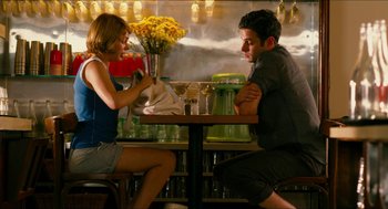 Movie still from “Take This Waltz” (2011), directed by Sarah Polley – A man and a woman sitting at a table in a restaurant; Medium shot, High angle
