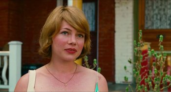 Movie still from “Take This Waltz” (2011), directed by Sarah Polley – A beautiful woman with short blonde hair and green eyes; Close Up shot, Over the shoulder angle