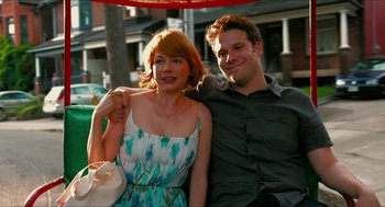 Movie still from “Take This Waltz” (2011), directed by Sarah Polley – A man and a woman sitting next to each other on a bench; Medium shot, Over the shoulder angle