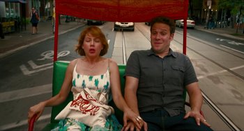 Movie still from “Take This Waltz” (2011), directed by Sarah Polley – A man and a woman sitting on a green bus; Medium shot, High angle