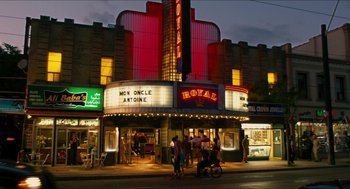 Movie still from “Take This Waltz” (2011), directed by Sarah Polley – People are standing in front of a movie theater at night; Extreme Wide shot, Low angle
