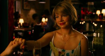 Movie still from “Take This Waltz” (2011), directed by Sarah Polley – A beautiful woman holding a glass of red wine; Close Up shot, Over the shoulder angle