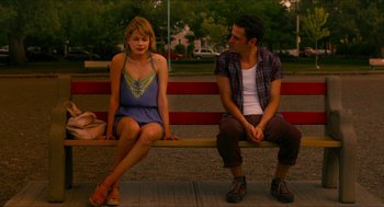 Movie still from “Take This Waltz” (2011), directed by Sarah Polley – A man and a woman sitting on a park bench; Medium shot, High angle