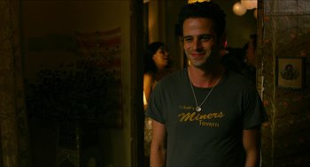 Movie still from “Take This Waltz” (2011), directed by Sarah Polley – A man standing in front of a mirror; Medium shot, Over the shoulder angle
