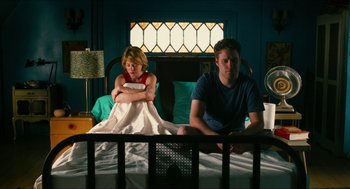 Movie still from “Take This Waltz” (2011), directed by Sarah Polley – A man and a woman sitting on a bed; Medium shot, Overhead angle