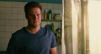 Movie still from “Take This Waltz” (2011), directed by Sarah Polley – A man standing next to a window in a bathroom; Close Up shot, Over the shoulder angle