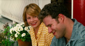 Movie still from “Take This Waltz” (2011), directed by Sarah Polley – A man and a woman smiling for the camera; Close Up shot, Over the shoulder angle