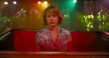 Movie still from “Take This Waltz” (2011), directed by Sarah Polley – A woman sitting in a booth at a restaurant; Medium shot, Over the shoulder angle