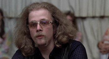 Movie still from “Taking Off” (1971), directed by Milos Forman – A person with long hair; Close Up shot, Low angle