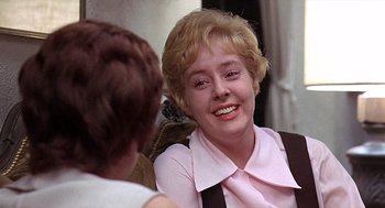 Movie still from “Taking Off” (1971), directed by Milos Forman – An older woman sitting in front of another woman; Close Up shot, Over the shoulder angle