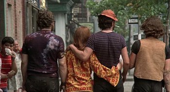 Movie still from “Taking Off” (1971), directed by Milos Forman – A group of people walking down a street; Medium shot, Over the shoulder angle