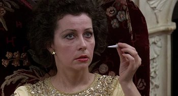 Movie still from “Taking Off” (1971), directed by Milos Forman – A person holding a cigarette; Close Up shot, Low angle