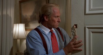 Movie still from “Tales from the Hood” (1995), directed by Rusty Cundieff – A man holding an award in his hands; Close Up shot, Low angle