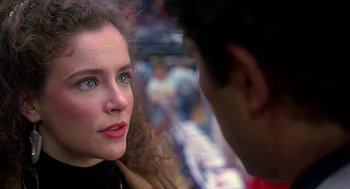 Movie still from “Talk Radio” (1988), directed by Oliver Stone – A person talking to another person; Close Up shot, Over the shoulder angle