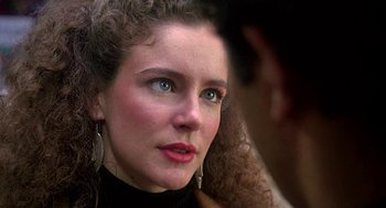 Movie still from “Talk Radio” (1988), directed by Oliver Stone – A person with blue eyes; Close Up shot, Over the shoulder angle