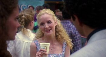 Movie still from “Talk Radio” (1988), directed by Oliver Stone – A woman holding a cup of coffee in her hand; Close Up shot, Over the shoulder angle