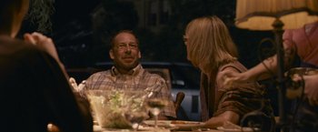 Movie still from “Tamara Drewe” (2010), directed by Stephen Frears – A man and a woman sitting at a dinner table; Medium shot, Over the shoulder angle