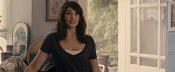 Movie still from “Tamara Drewe” (2010), directed by Stephen Frears – A beautiful young woman standing next to a window; Medium shot, Over the shoulder angle