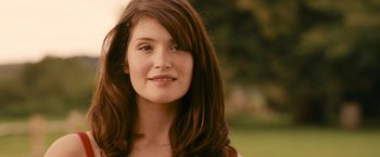 Movie still from “Tamara Drewe” (2010), directed by Stephen Frears – A beautiful young lady with long brown hair; Close Up shot, Over the shoulder angle