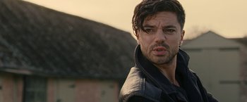 Movie still from “Tamara Drewe” (2010), directed by Stephen Frears – A person wearing a leather jacket; Close Up shot, Over the shoulder angle