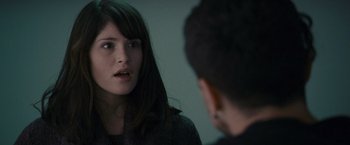 Movie still from “Tamara Drewe” (2010), directed by Stephen Frears – A young woman talking to a young man in front of a mirror; Close Up shot, Over the shoulder angle