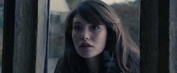 Movie still from “Tamara Drewe” (2010), directed by Stephen Frears – A person with long dark hair; Close Up shot, Over the shoulder angle