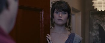 Movie still from “Tamara Drewe” (2010), directed by Stephen Frears – A woman standing in front of an open door; Close Up shot, Over the shoulder angle