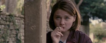 Movie still from “Tamara Drewe” (2010), directed by Stephen Frears – A woman is smoking a cigarette in the woods; Close Up shot, Over the shoulder angle