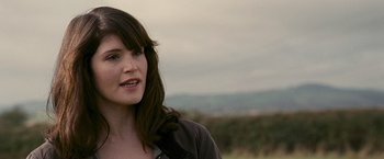 Movie still from “Tamara Drewe” (2010), directed by Stephen Frears – A person wearing a jacket; Close Up shot, Over the shoulder angle