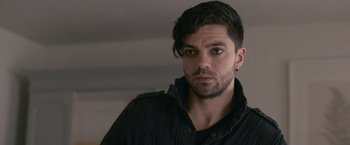 Movie still from “Tamara Drewe” (2010), directed by Stephen Frears – A person wearing a black jacket; Close Up shot, Over the shoulder angle