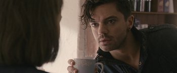 Movie still from “Tamara Drewe” (2010), directed by Stephen Frears – A person holding a cup of coffee; Close Up shot, Over the shoulder angle