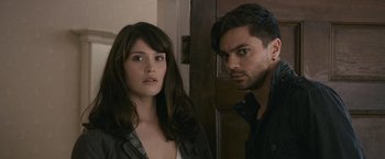 Movie still from “Tamara Drewe” (2010), directed by Stephen Frears – A man and a woman standing next to each other in a room; Close Up shot, Over the shoulder angle