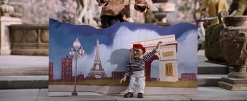 Movie still from “Team America: World Police” (2004), directed by Trey Parker – A marionette on a stage; Wide shot, Low angle