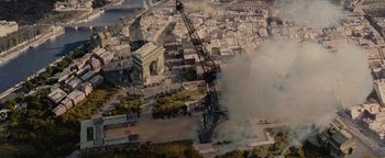 Movie still from “Team America: World Police” (2004), directed by Trey Parker – An aerial view of a city with a crane in the middle of it; Extreme Wide shot, High angle