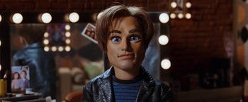 Movie still from “Team America: World Police” (2004), directed by Trey Parker – The face of a man in a jacket; Close Up shot, High angle