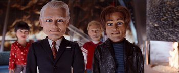 Movie still from “Team America: World Police” (2004), directed by Trey Parker – Two men and a boy are dressed in suits and wigs; Close Up shot, Low angle