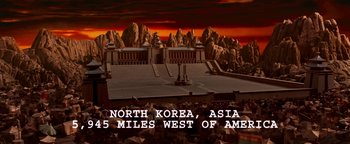 Movie still from “Team America: World Police” (2004), directed by Trey Parker – An image of an asian city in the middle of the night; Extreme Wide shot, High angle