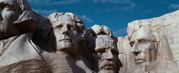 Movie still from “Team America: World Police” (2004), directed by Trey Parker – View of the faces of two presidents; Extreme Close Up shot, Low angle