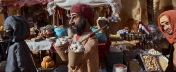 Movie still from “Team America: World Police” (2004), directed by Trey Parker – A man holding two baskets of food in his hands; Close Up shot, High angle