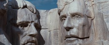 Movie still from “Team America: World Police” (2004), directed by Trey Parker – View of the faces of two people; Close Up shot, Low angle